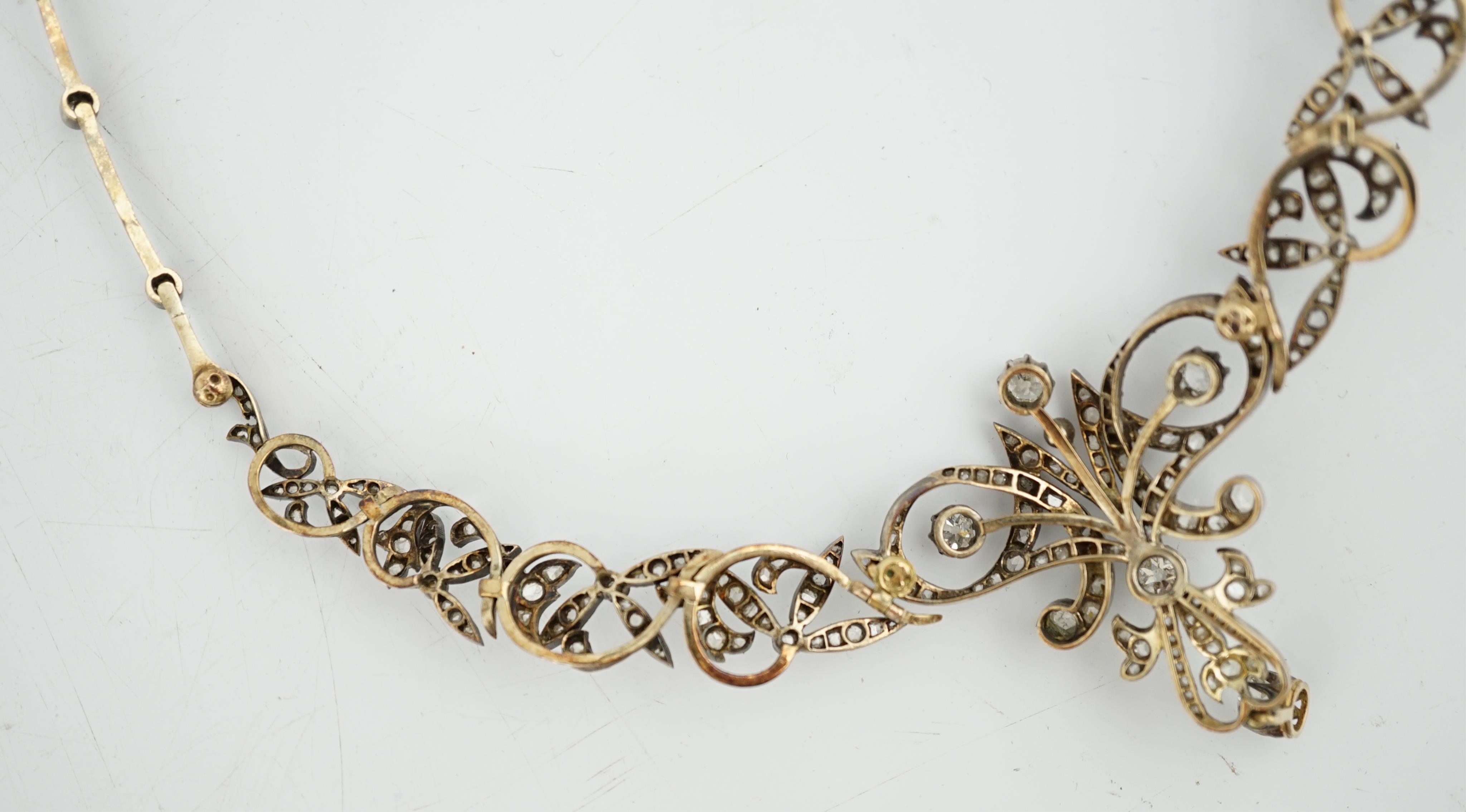 A late 19th/early 20th century French 18ct gold and silver, old mine and rose cut diamond cluster set tiara/necklace